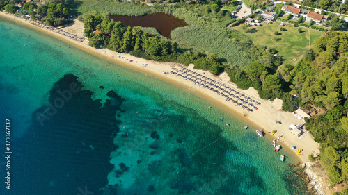 Aerial drone photo of popular paradise turquoise beach of Vromolimnos with small swamp next to it  Skiathos island  Sporades  Greece