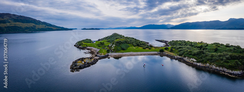 Aerial view of the sound of shuna and shuna island on the west coast of the argyll region of the highlands of Scotland during a summer storm showing a salmon fish farm
 photo