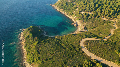 Aerial drone photo of secluded emerald beach of Krifi or "hidden beach" in island of Skiathos, Sporades, Greece