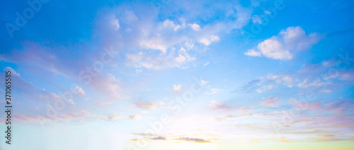 Fototapeta Naklejka Na Ścianę i Meble -  Blue sky clouds background. Beautiful landscape with clouds and orange sun on sky