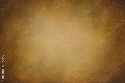 Texture for artwork and photography. Abstract dark yellow stained paper texture background or backdrop.