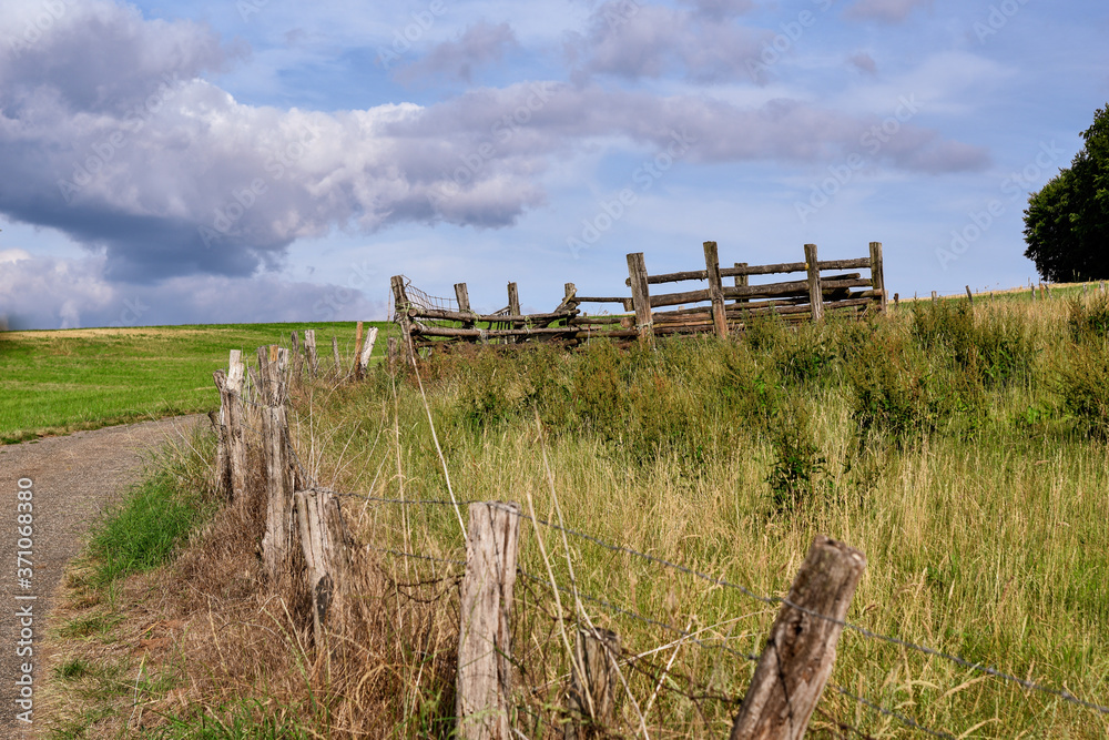 old wooden fence in field