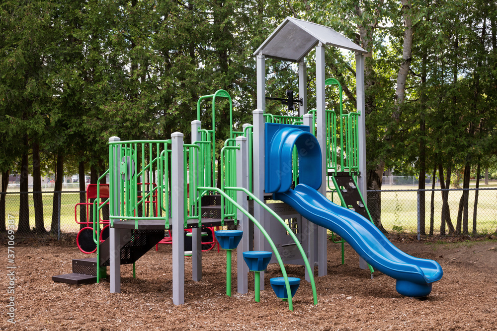 Colorful empty playground in park without kids Colorful empty playground in park without kids