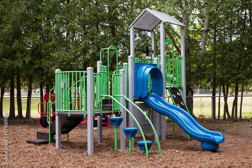 Colorful empty playground in park without kids