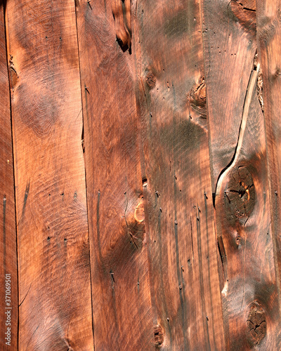 rustic wood cabin siding of settlers cabin in mining camp in Idaho mountains. Rustic wood grain design