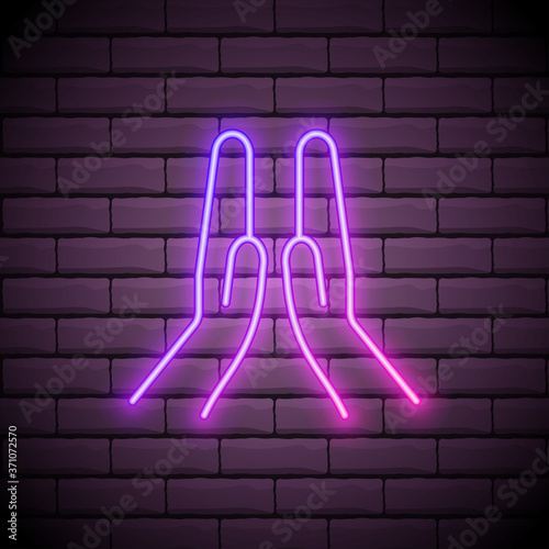 Praying glowing neon ui ux icon. Glowing sign logo vector isolated on dark brick wall
