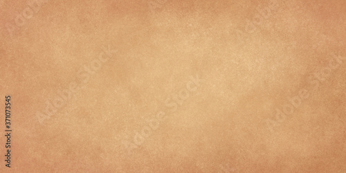 light brown grunge background with shaded edges and texture. Beige textured shabby old background for banners, web sites, brochures.