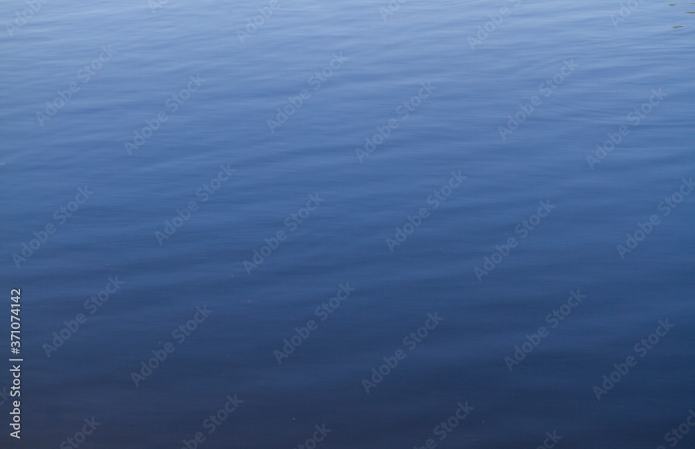blue water surface with small ripples blue water surface with small ripples