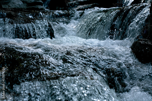 Waterfall of river in mountains.