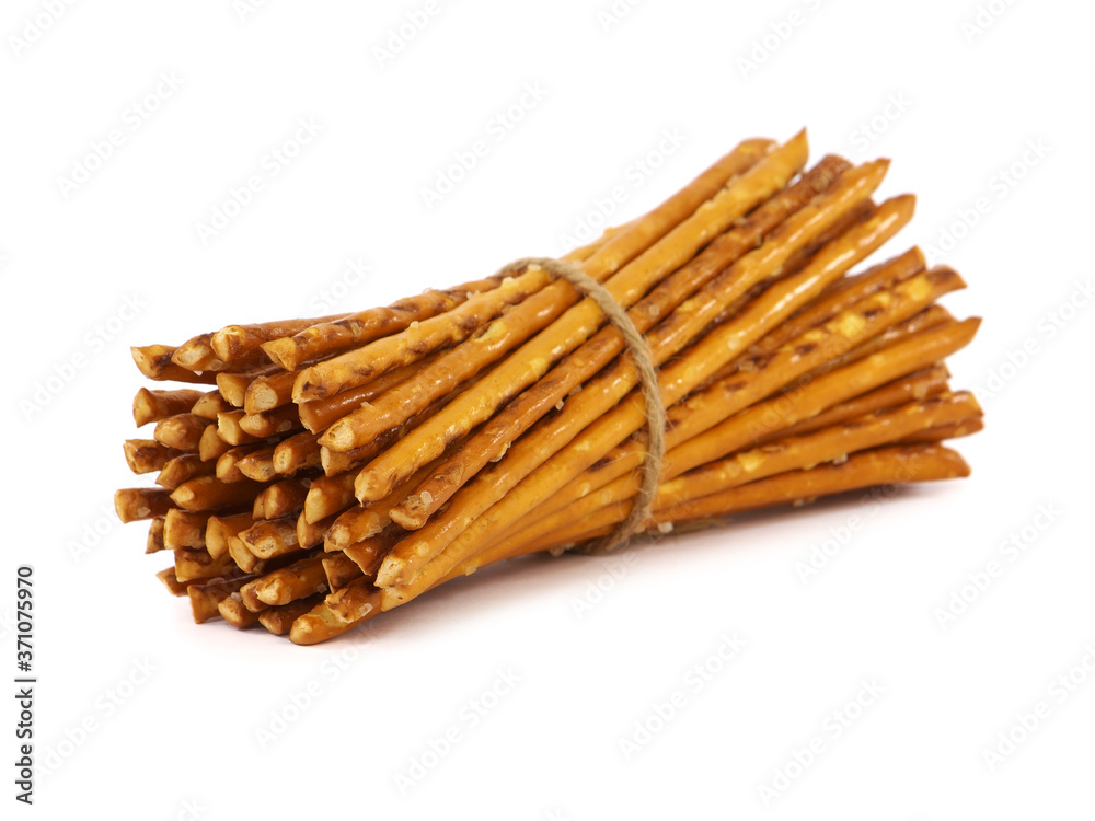 Pretzel sticks with salt tied with string, isolated on a white