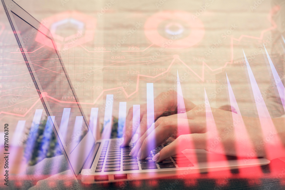 Multi exposure of woman hands typing on computer and forex chart hologram drawing. Stock market analysis concept. Multi exposure of woman hands typing on computer and forex chart hologram drawing. Stock market analysis concept.