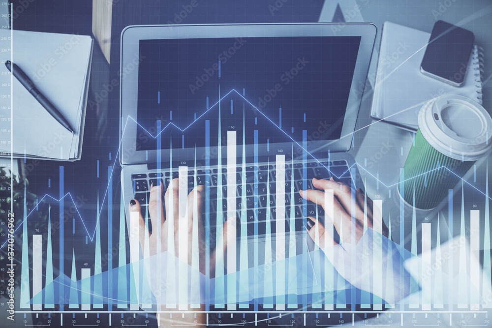 Double exposure of woman hands typing on computer and forex chart hologram drawing. Stock market invest concept. Double exposure of woman hands typing on computer and forex chart hologram drawing. Stock market invest concept.