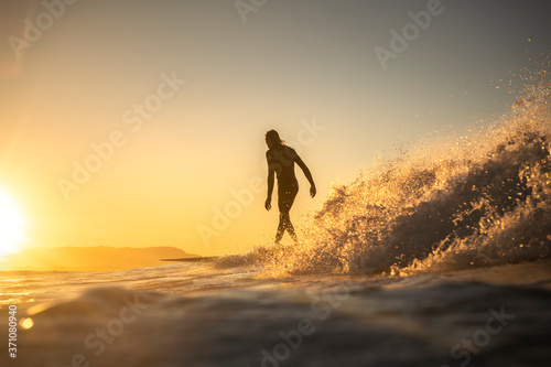 Surfing at sunset, Byron Bay Australia © Gary