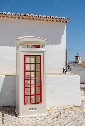 A traditional Old Telephone Booth in a small village in Portugal photo