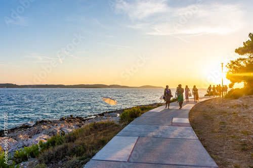Fototapeta Naklejka Na Ścianę i Meble -  HVAR, CROATIA, AUGUST 8 2019: Promenade of Hvar at sunset
