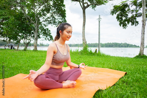 Yoka of a woman in the park , Sport concept. photo