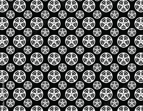 Triple white bicycle chain ring over a black background. Stamps, textile and t shirt cycling concept