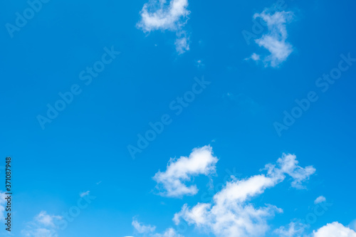 Blue sky with a tiny clouds in bright day.