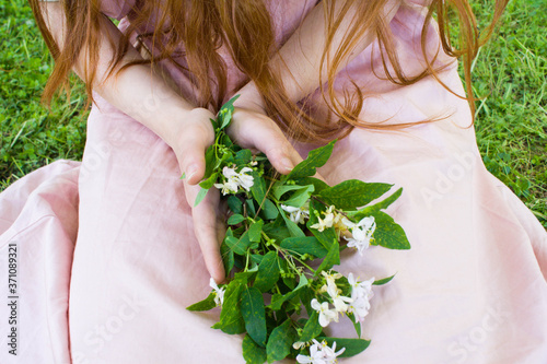Women s hands with bouquet of country flowers