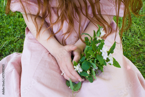 Women s hands with bouquet of country flowers