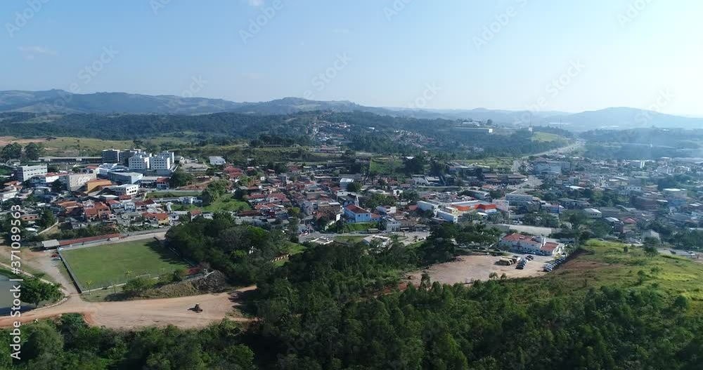 Plan with Drone in lateral movement of small town in the interior of São Paulo, small houses and beautiful countryside landscape in the background, in 4K resolution Plan with Drone in lateral movement of small town in the interior of São Paulo, small houses and beautiful countryside landscape in the background, in 4K resolution
