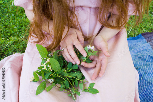Women s hands with bouquet of country flowers