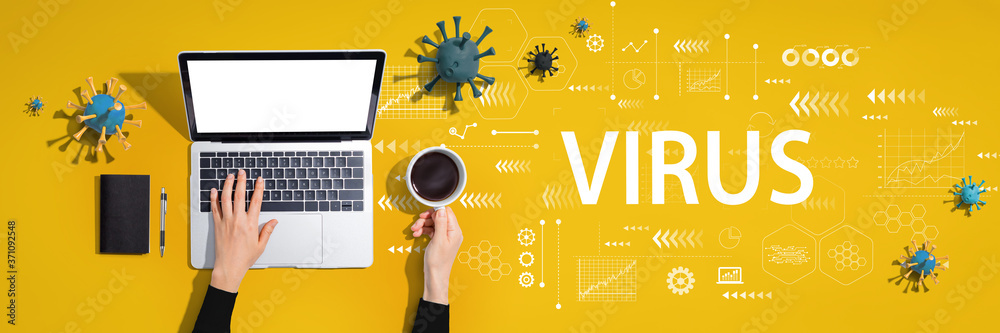 Virus and Coronavirus theme with person using a laptop computer Virus and Coronavirus theme with person using a laptop computer