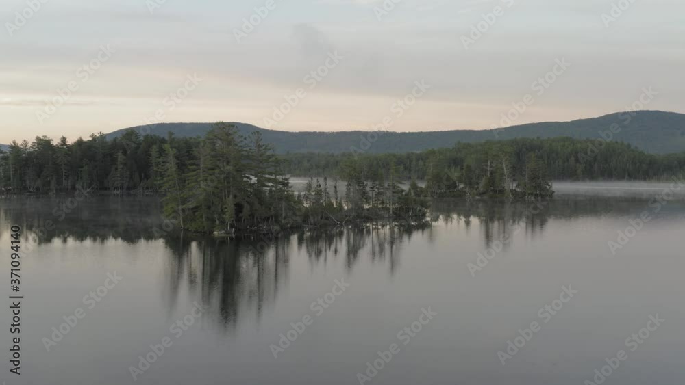 Prong Pond island wilderness aerial sunrise pull back Prong Pond island wilderness aerial sunrise pull back