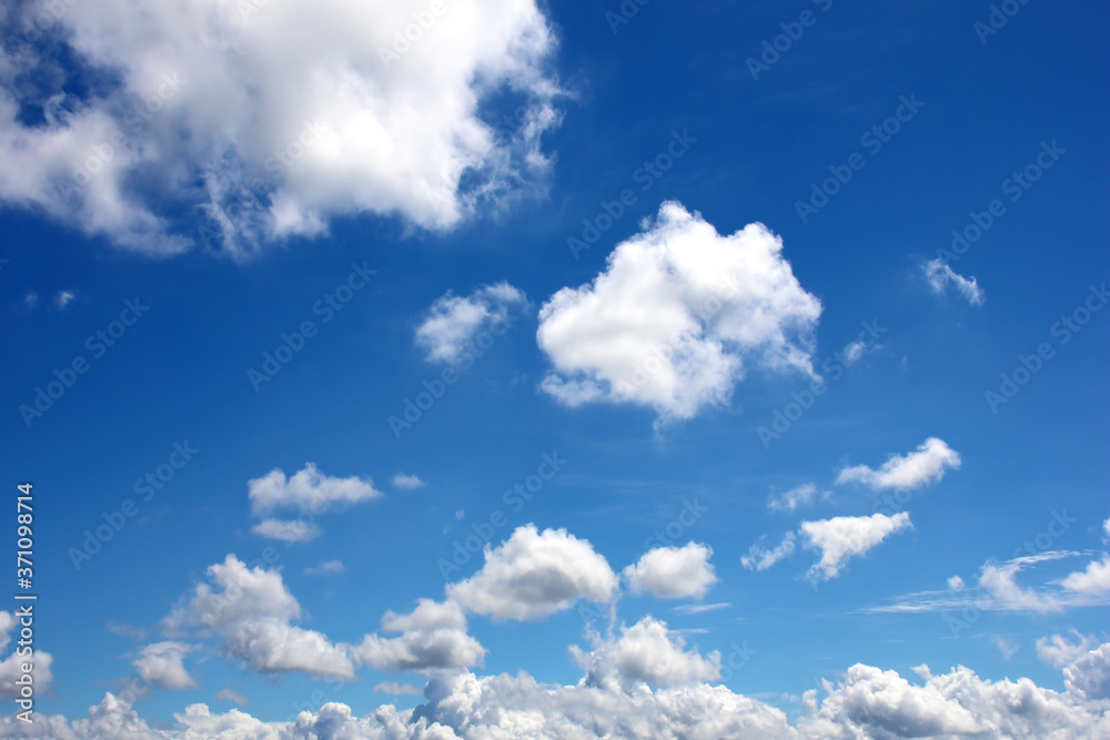 White fluffy clouds on blue sky nature background White fluffy clouds on blue sky nature background