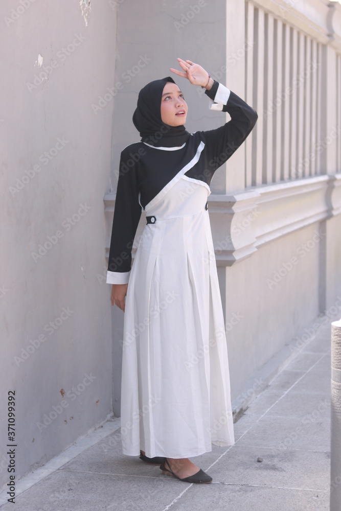 Fashion portrait of young beautiful asian muslim woman with wearing hijab. Fashion portrait of young beautiful asian muslim woman with wearing hijab.