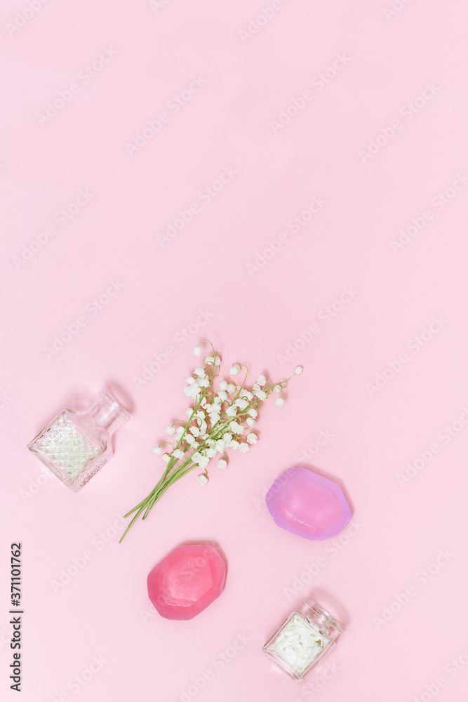 Handmade soap and white flowers lilies of the valley. Spa, aromatherapy and body care treatment concept. Flat lay with copy space. Handmade soap and white flowers lilies of the valley. Spa, aromatherapy and body care treatment concept. Flat lay with copy space.