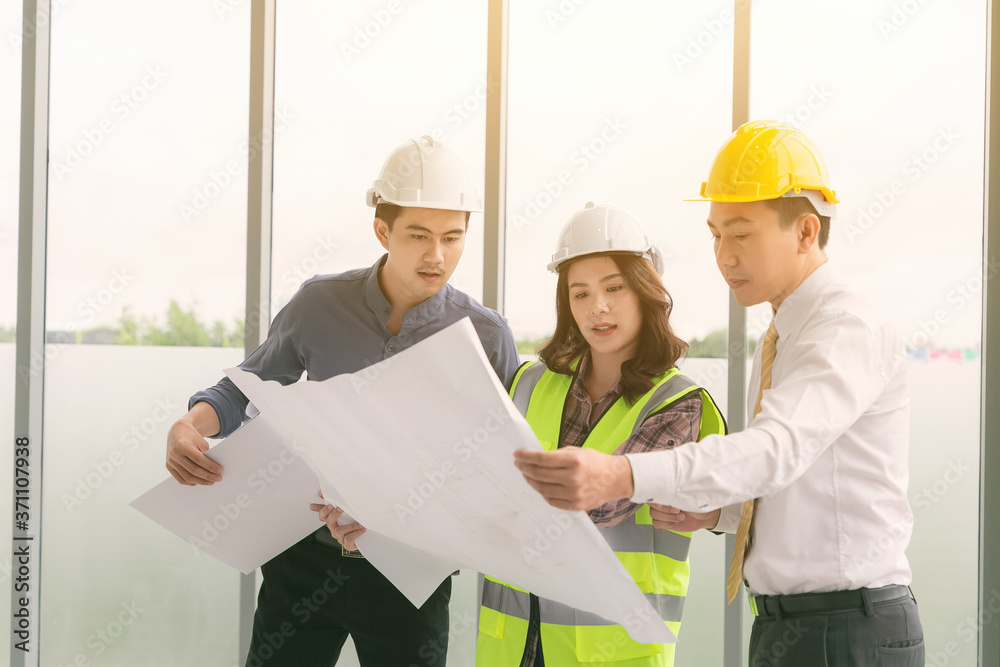 Instructor with young people in engineering training in construction on site work. Instructor with young people in engineering training in construction on site work.