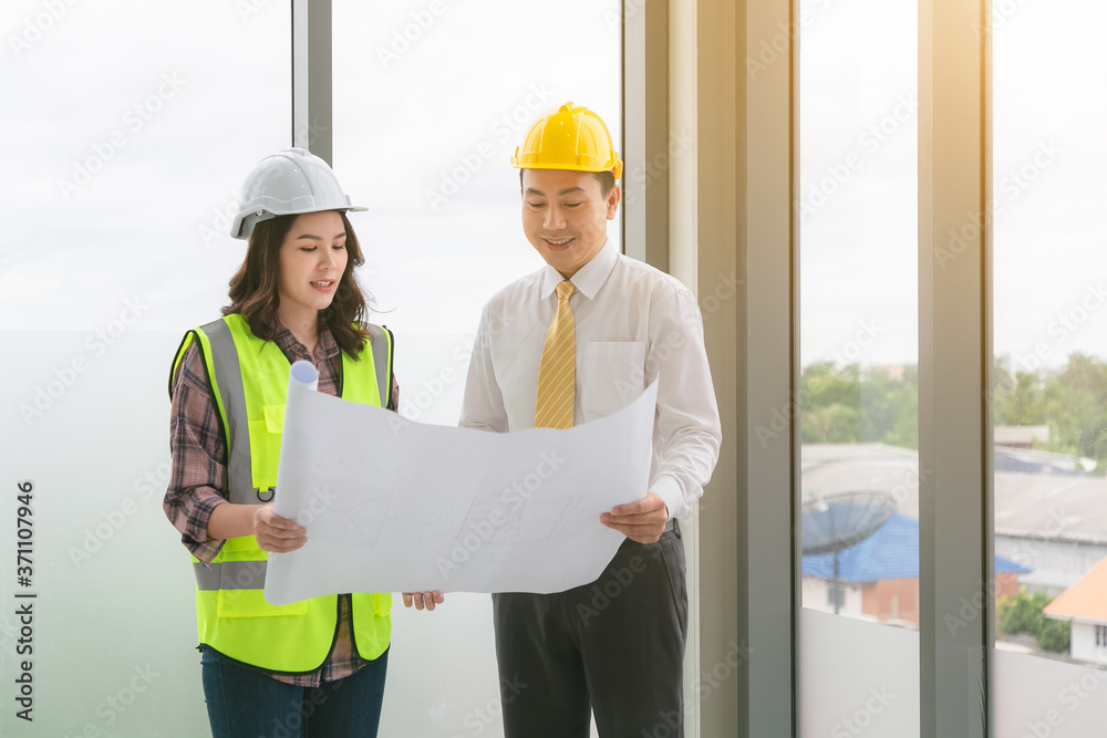 Two business construction site engineer. Engineering objects on workplace with partners on background. Two business construction site engineer. Engineering objects on workplace with partners on background.