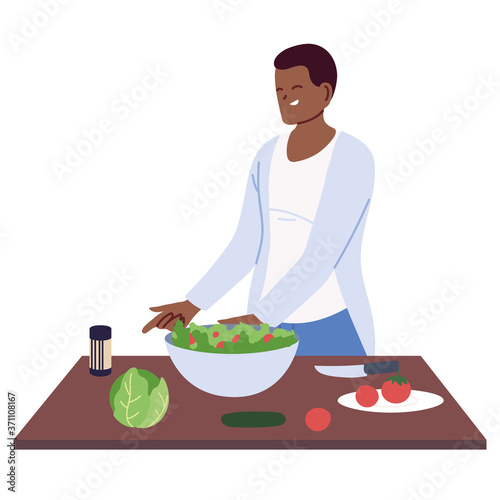 man preparing a salad on white background