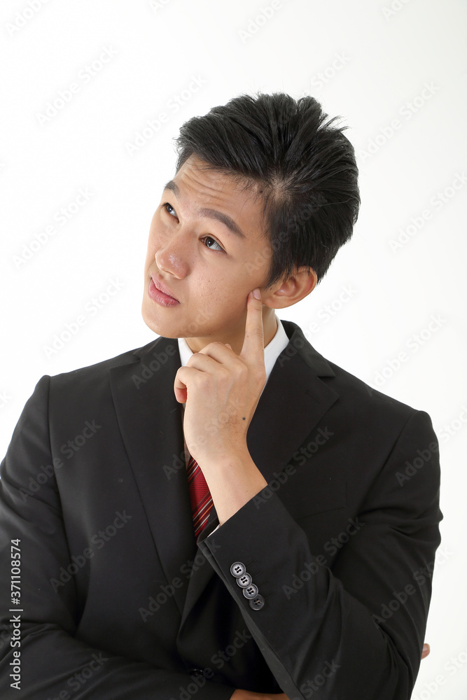 South East Asian young Chinese man wearing formal business office ware on white pose hand on cheek South East Asian young Chinese man wearing formal business office ware on white pose hand on cheek