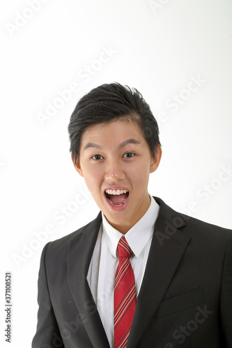 South East Asian young Chinese man wearing formal business office ware on white pose surprised look at camera