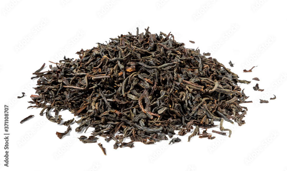 Dry black tea leaves isolated on white close-up Dry black tea leaves isolated on white close-up