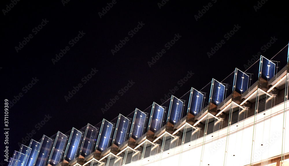 Tempered laminated glass railing of walkway and balcony, frame less balustrade panels, safety glass for modern architectural buildings. Close up detail of film and layer thickness, joint and bolt. Tempered laminated glass railing of walkway and balcony, frame less balustrade panels, safety glass for modern architectural buildings. Close up detail of film and layer thickness, joint and bolt.