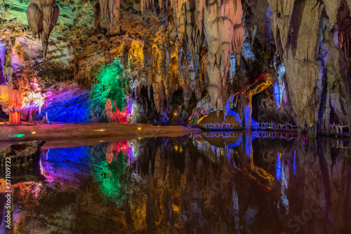 Ancient underground cave stalactites and groundwater landscape © bqmeng