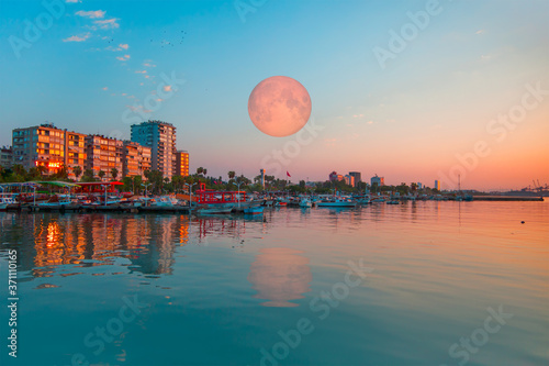 Coastal cityscape with modern buildings at dusk - Mersin, Turkey "Elements of this image furnished by NASA "