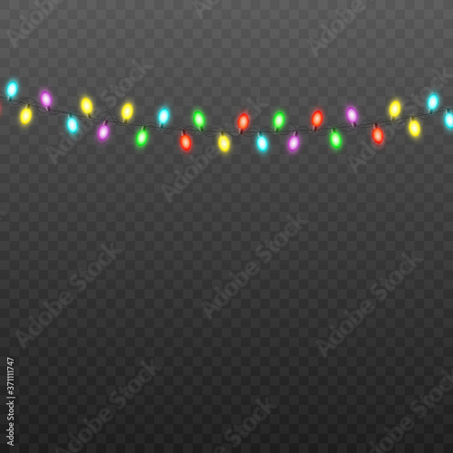 Colorful Christmas lights string isolated on black semi transparent background