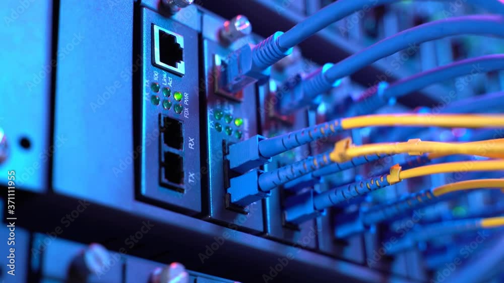 Fiber Optic cables connected to an optic ports and Network cables connected to ethernet ports Fiber Optic cables connected to an optic ports and Network cables connected to ethernet ports