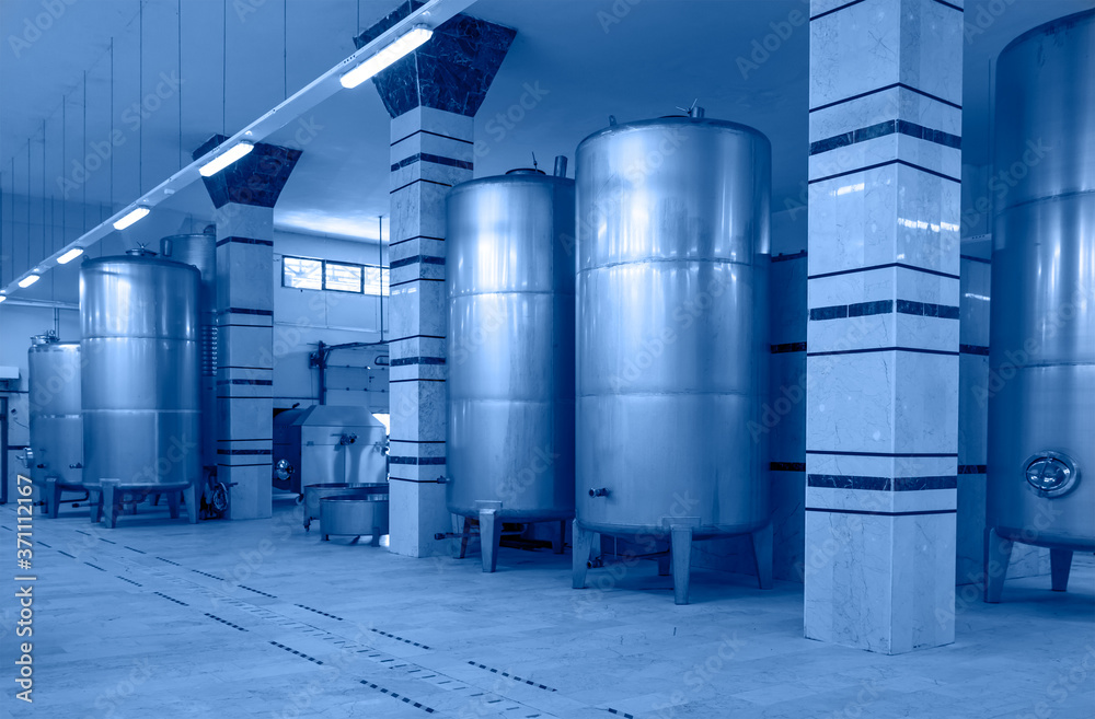Contemporary large steel barrels in winery, food industry Contemporary large steel barrels in winery, food industry