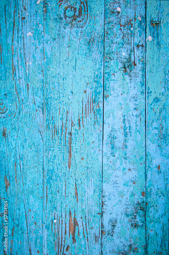 Wood texture, old boards with peeling blue paint