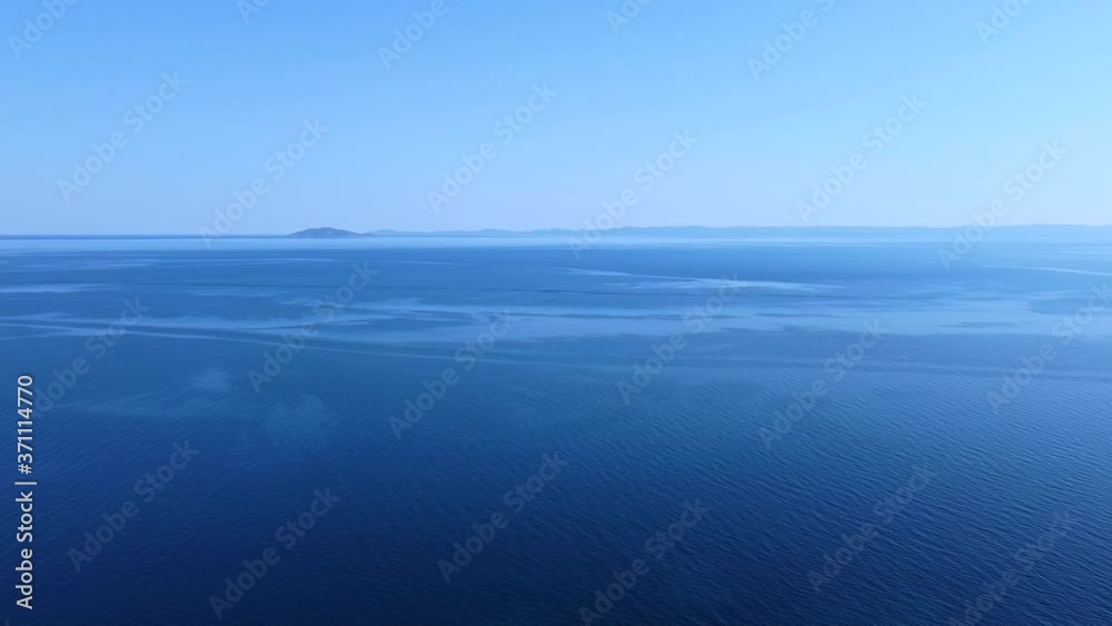 Aerial drone view of tranquil blue sea water in summer season. Aerial drone view of tranquil blue sea water in summer season.
