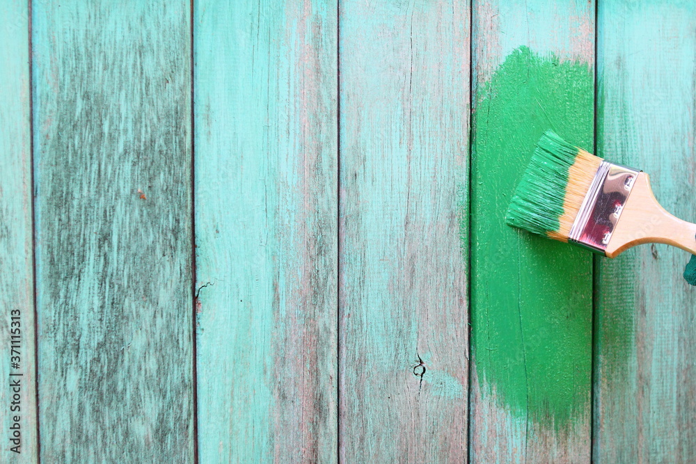 A wall of planks. Brush painting in green A wall of planks. Brush painting in green