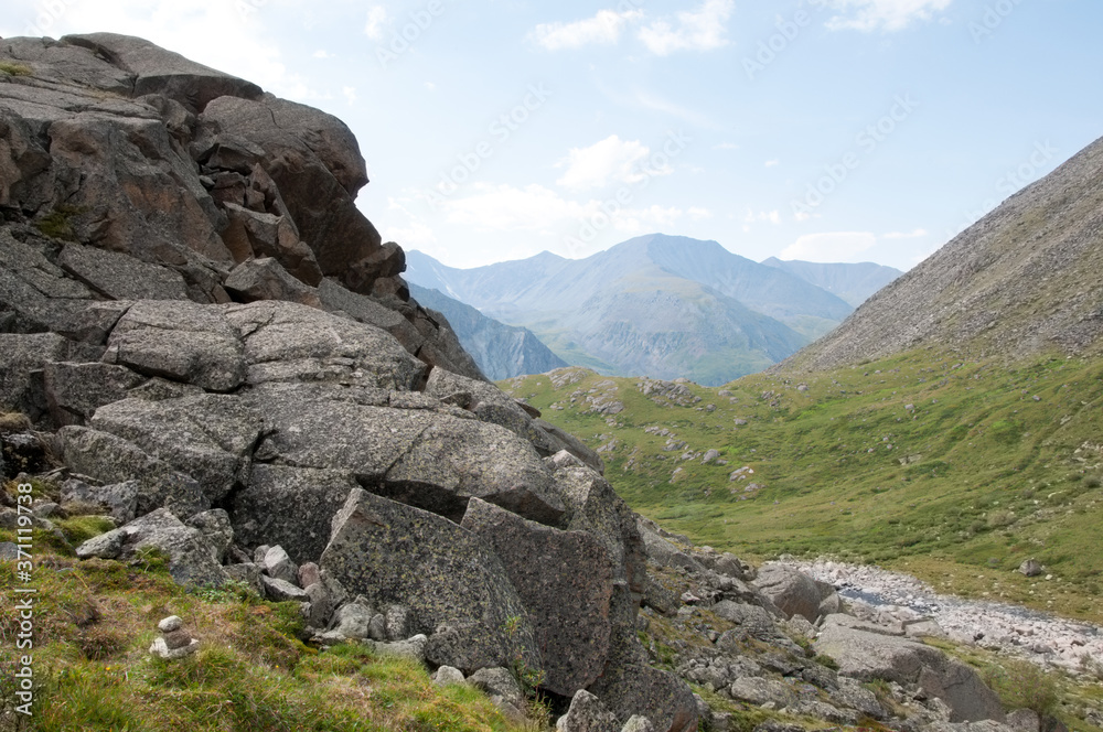 Landscape view of Altai wilderness with huge boulders in the foreground, the Altai Republic, Russia Landscape view of Altai wilderness with huge boulders in the foreground, the Altai Republic, Russia