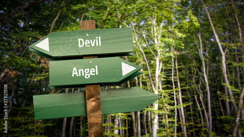 Fototapeta Naklejka Na Ścianę i Meble -  Street Sign to Angel versus Devil