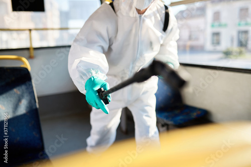 Close-up of disinfection of public transportation due to COVID-19 pandemic.