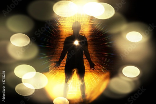 Meditating image :Human Spiritual awakening in standing pose. mindfulness illustration.Heart chakras activate and aura glow in darkness, selective bokeh lens flare effect